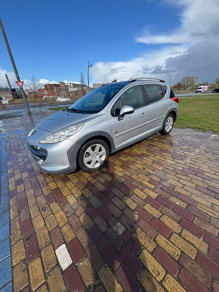 Peugeot 207 1.6 SW Outdoor 2008 Grijs 129000km NAP 3e eig, Zwart, 4 cilinders, Leder en Stof, 1110 kg