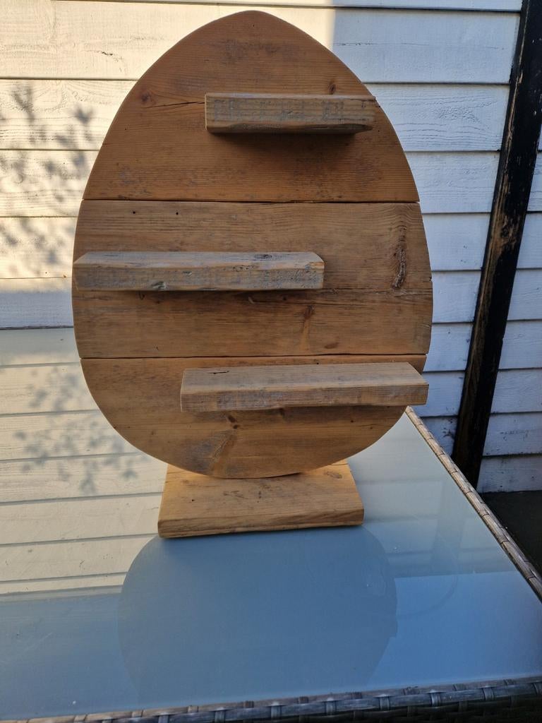 Houten paasei, Ophalen