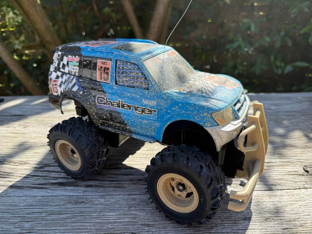 Stoere retro Nikko R/C auto - Challenger, Hobby en Vrije tijd, Modelbouw | Radiografisch | Auto's, Gebruikt, Auto offroad, Overige schalen