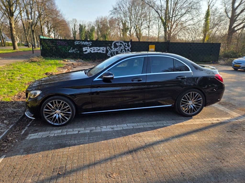 Mercedes-Benz C-Klasse AMG  C180 1.6 115KW Aut7 2014 Zwart, Auto's, Mercedes-Benz, Automaat, 1800 kg, Zwart, Zwart