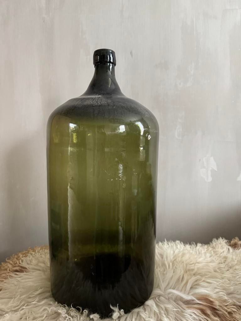 Oude groene gistfles van distilleerderij Hooghoudt, Ophalen