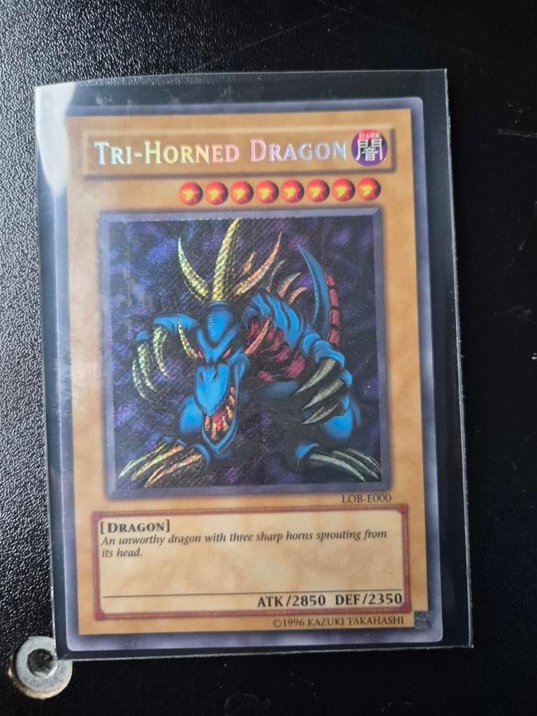 Yu-Gi-Oh! Tri-Horned Dragon LOB-E000 Kaart, Ophalen of Verzenden