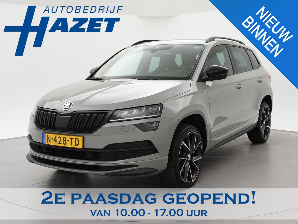 Skoda Karoq 1.5 TSI ACT 150 PK DSG SPORTLINE + CANTON AUDIO, Auto's, Stof, 4 cilinders, 19 km/l, Adaptive Cruise Control