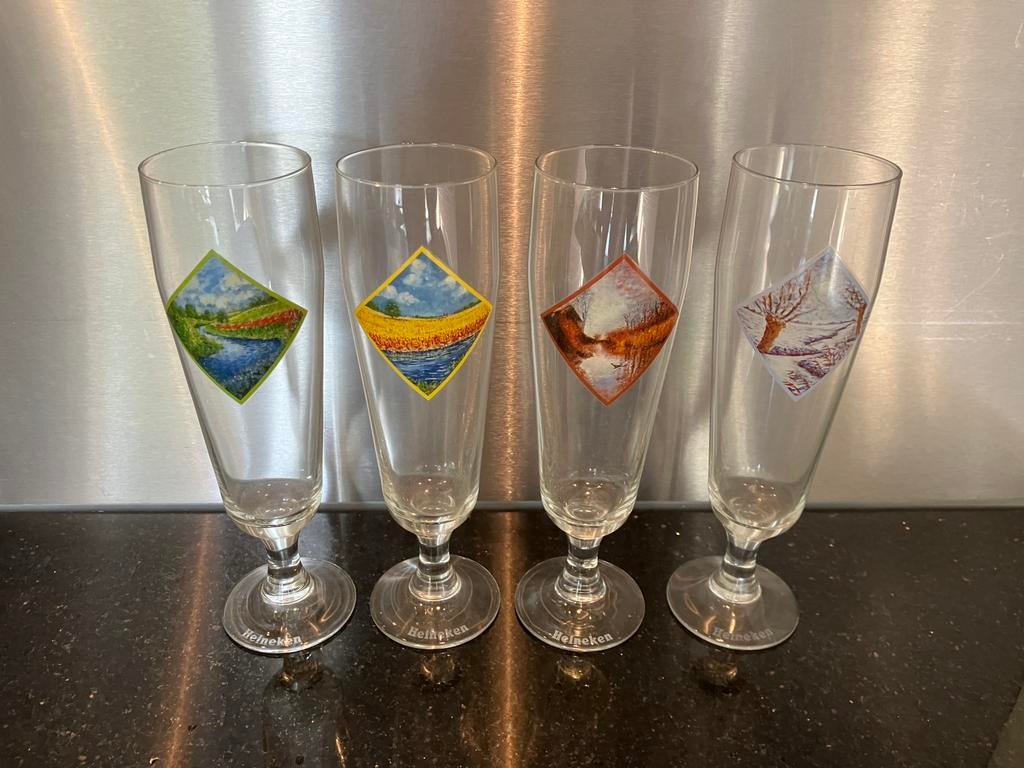 Serie Heineken bierglazen - zeldzaam!, Ophalen, Zo goed als nieuw, Bierglas