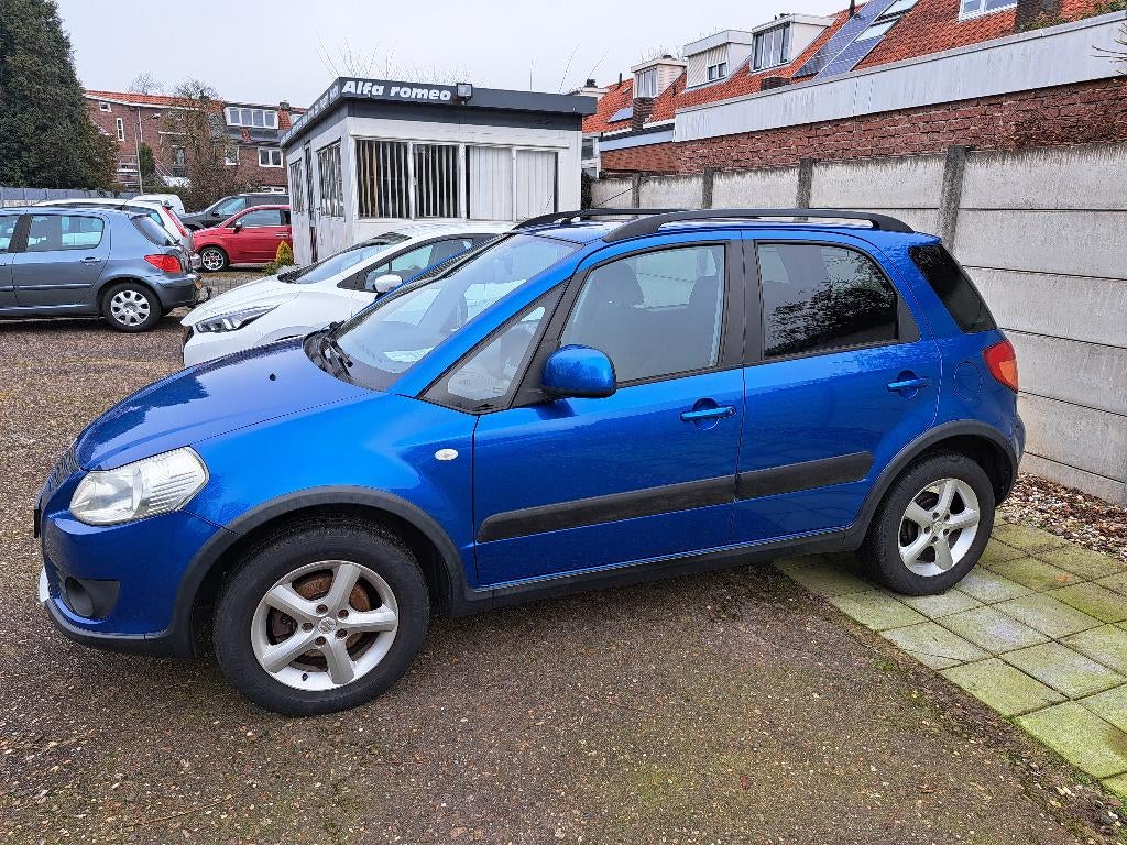 Suzuki SX4 1.6 5D AWD 2007 Blauw dealer onderhouden, Auto's, Stof, Elektrische ramen, 4 cilinders, 1165 kg