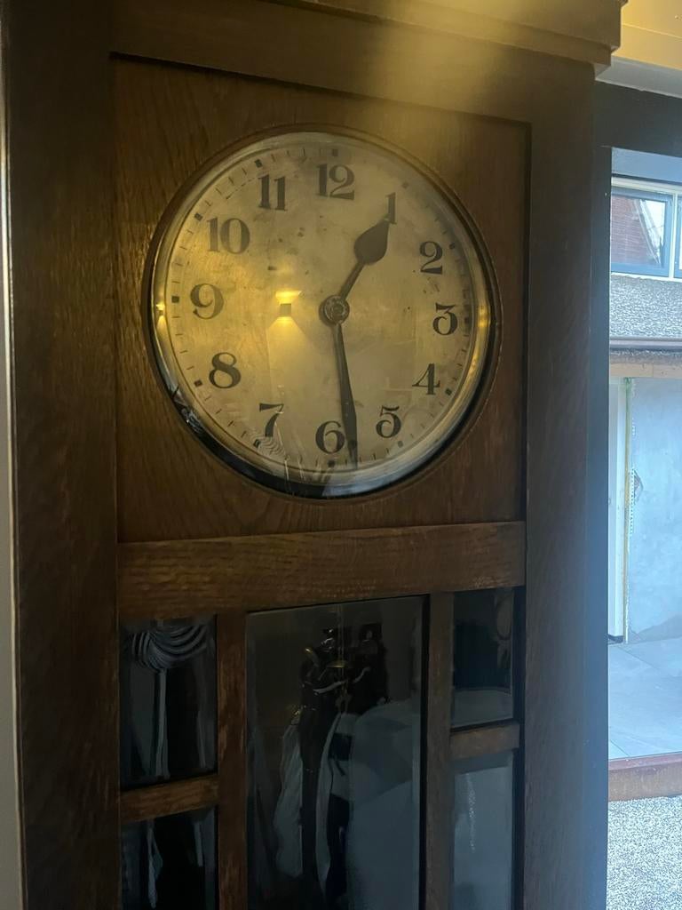 Oude staande slingerklok, Ophalen