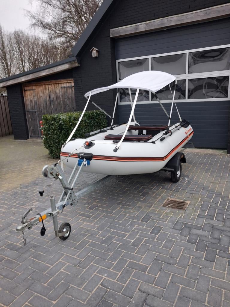 Rubberboot met trailer en motor., Watersport en Boten, Rubberboten, Elektrisch, Zo goed als nieuw, Hout, Minder dan 70 pk