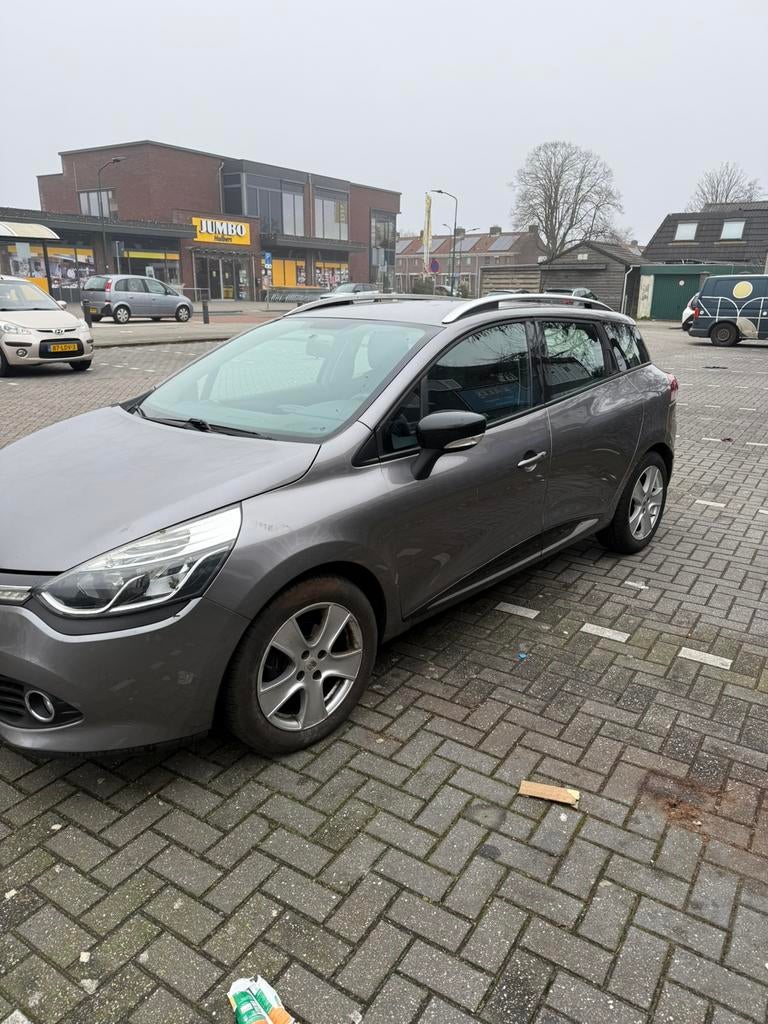Renault Clio 1.5 DCI 66KW Estate 2015 Grijs, Auto's, Renault, Voorwielaandrijving, Stof, Zwart, 4 cilinders
