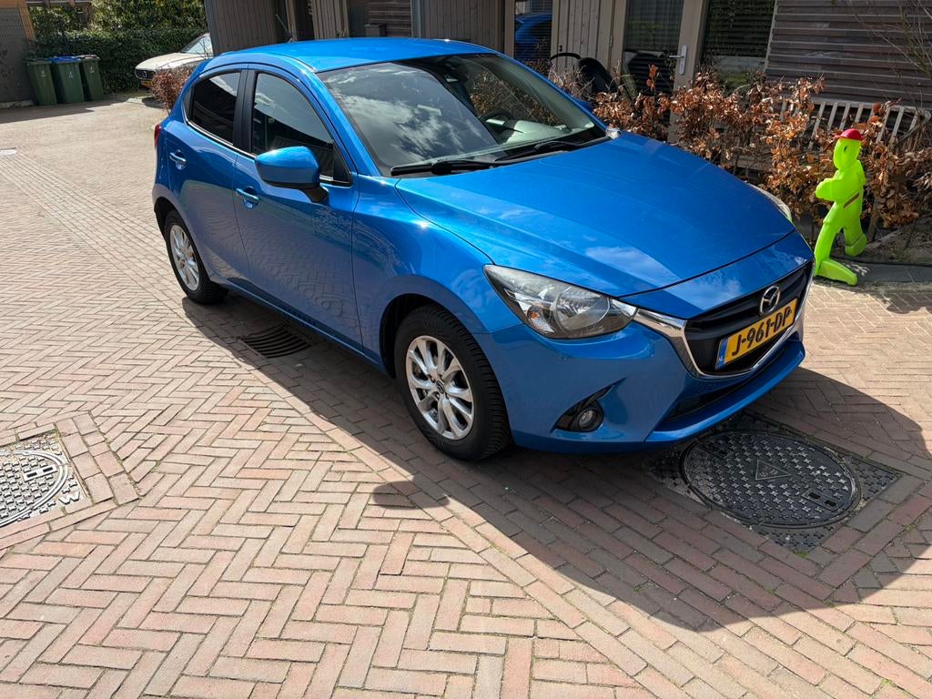 Mazda 2 1.5 66KW 5DRS AUT 2015 Blauw, Auto's, Stof, 31 €/maand, 4 cilinders, Blauw