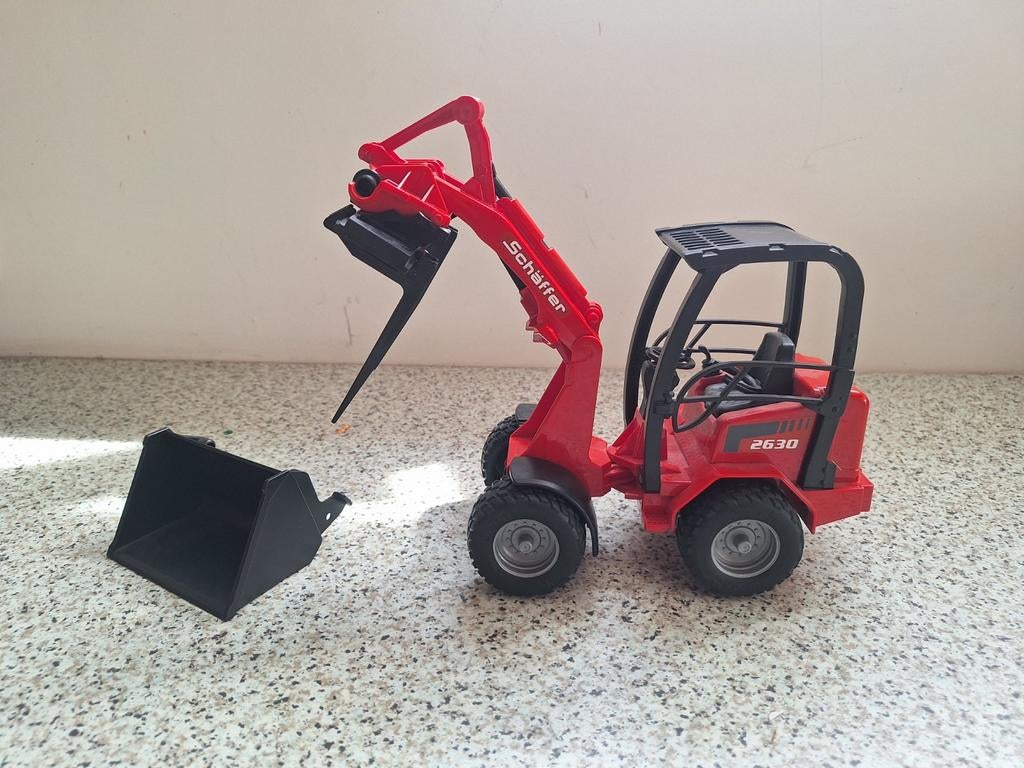 Schäffer kniklader met palletlepels en grondbak, Ophalen of Verzenden, Zo goed als nieuw