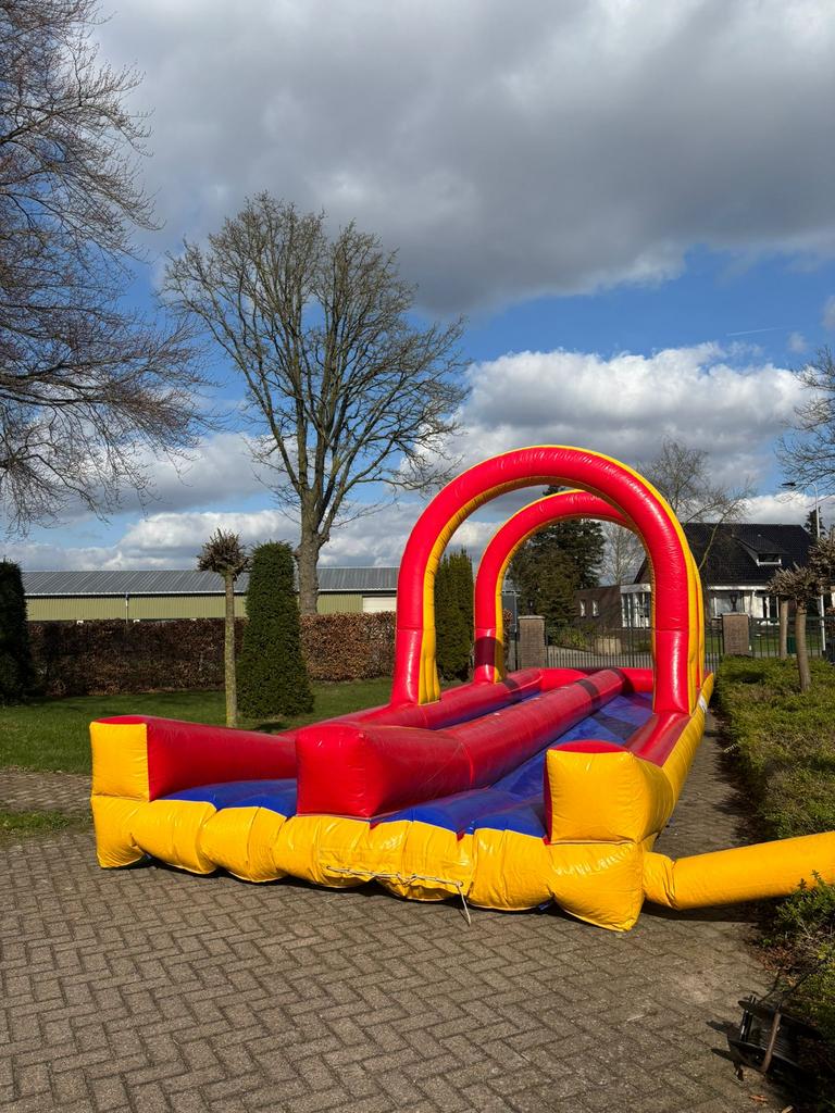 Super gaaf springkussen buikschuifbaan 10 meter  te koop, Hobby en Vrije tijd, Feestartikelen | Verhuur, Ophalen of Verzenden