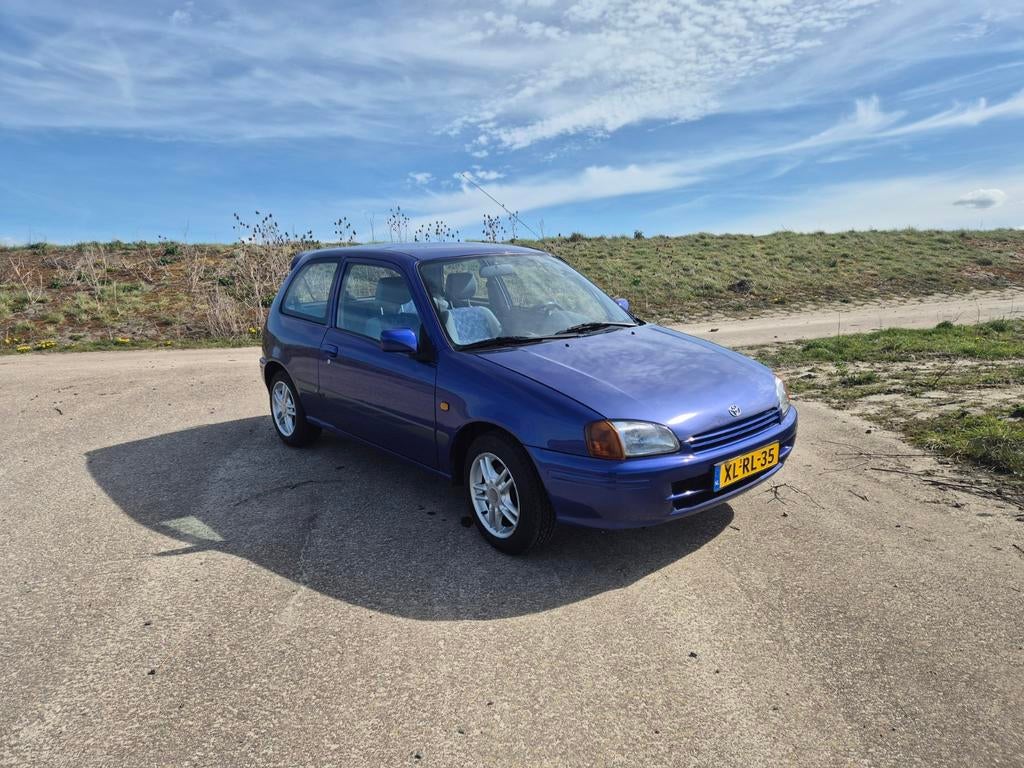 Toyota Starlet 1.3 16V 1998 Blauw, Auto's, 74 pk, 4 cilinders, Starlet, Origineel Nederlands