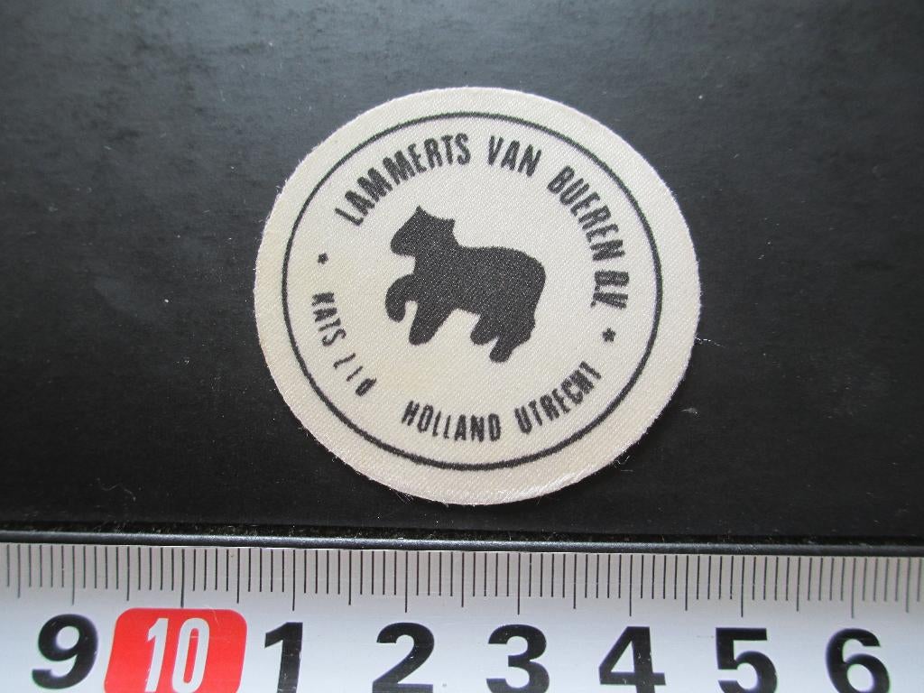 sticker textiel logo lammerts van bueren bv kats ltd utrecht, Ophalen, Zo goed als nieuw