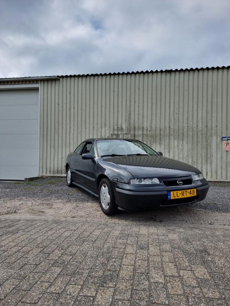 Opel Calibra 2.0 I E2 1995 Zwart, Auto's, Voorwielaandrijving, Stof, Calibra, Zwart