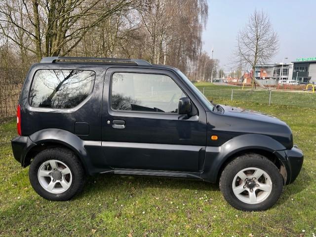 Suzuki Jimny 1.3 JLX AIRCO/4XWD/!/ALLE BOEKJES/NETTE AUTO!va, Euro 5, Gebruikt, 4 stoelen, Zwart