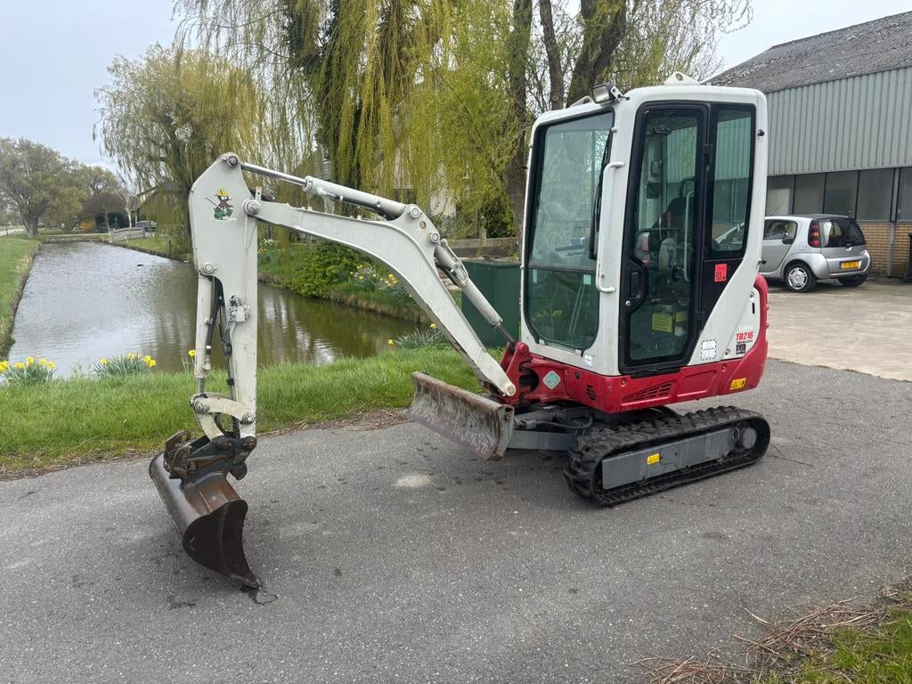 Takeuchi TB216, Zakelijke goederen, Ophalen of Verzenden, Graafmachine