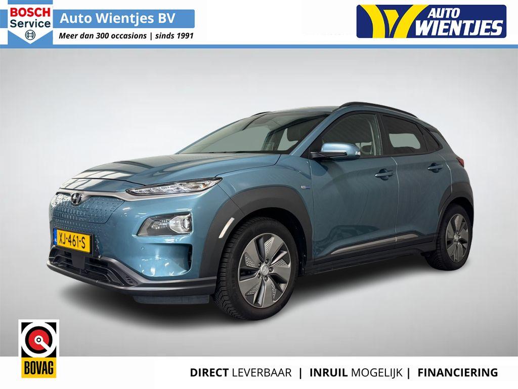 Hyundai Kona EV Premium 64kWh | SOH 100% | Leer | Navi | Tre, Gebruikt, Blauw, Regensensor, 630 min