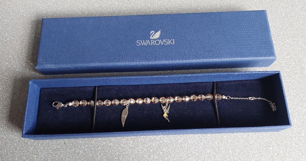 Swarovski Disney armband met Tinkerbell kleur taupe, Ophalen of Verzenden, Overige figuren, Zo goed als nieuw, Overige typen