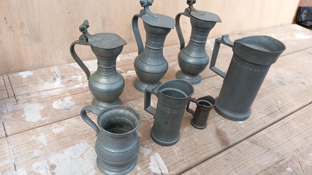 7 tinnen kannen, Ophalen