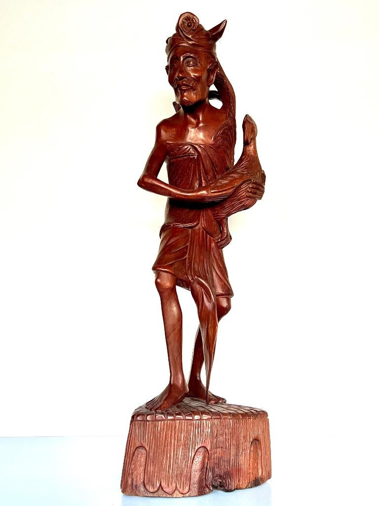 Balinese man met zijn vechthaan en keris kris op zijn rug, Ophalen of Verzenden