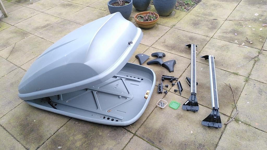 Dakdragers + dakkoffer (Citroën C4, Berline)., Ophalen