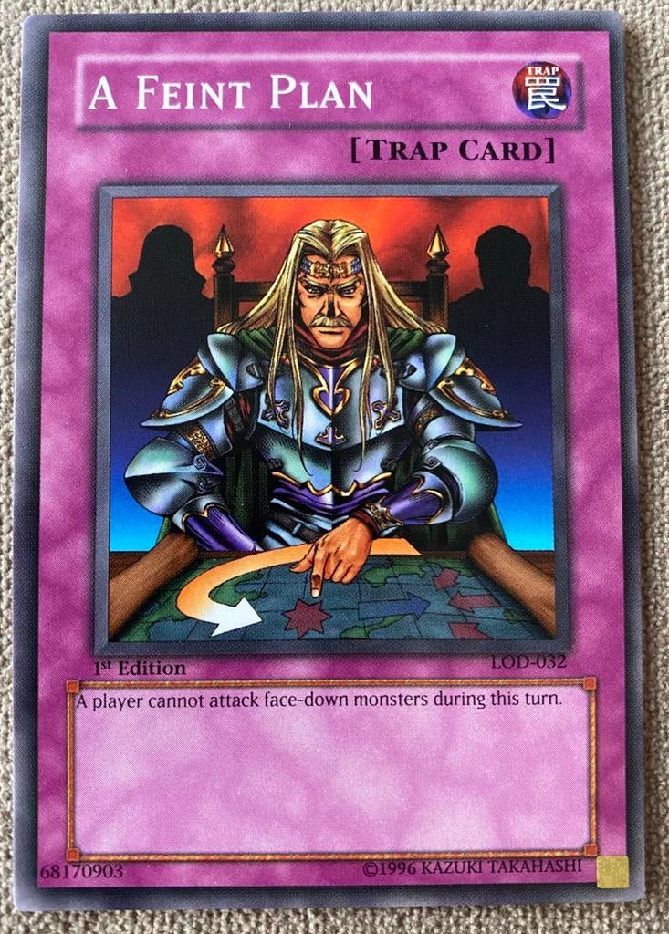 Yu-Gi-Oh! Misprint A Feint Plan LOD in 1st Edition M/NM !, Ophalen of Verzenden, Zo goed als nieuw, Losse kaart
