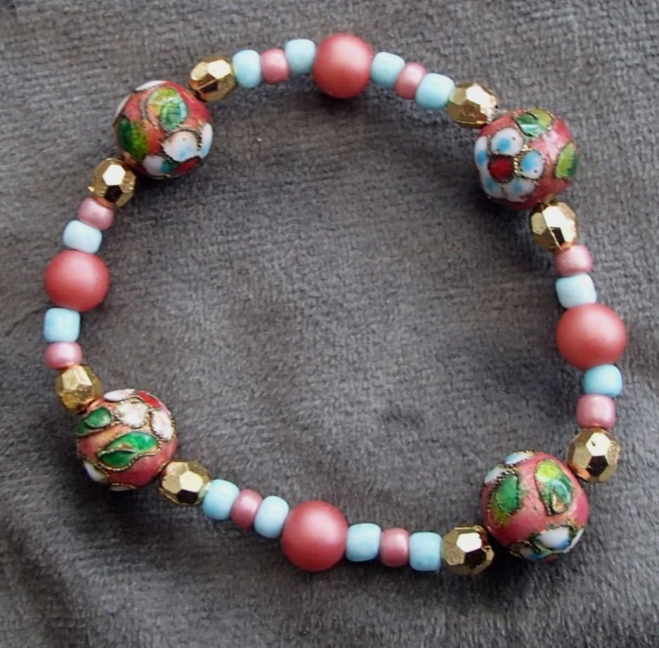 ARMBAND MET BLOEMETJESKRAAL ,GOUD NIEUW ELASTISCH, Sieraden, Tassen en Uiterlijk, Armbanden, Overige materialen, Nieuw, Ophalen of Verzenden