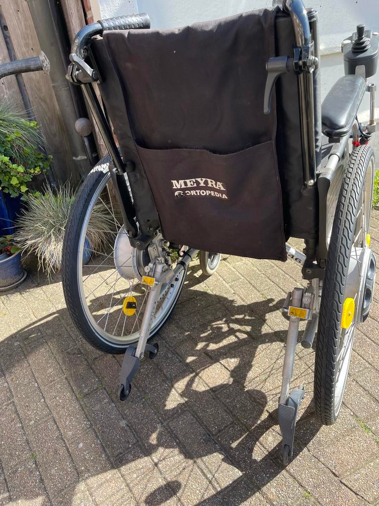 Nette (elektrische) rolstoel., Ophalen, Elektrische rolstoel