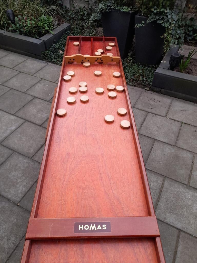 Homas sjoelbak, Ophalen