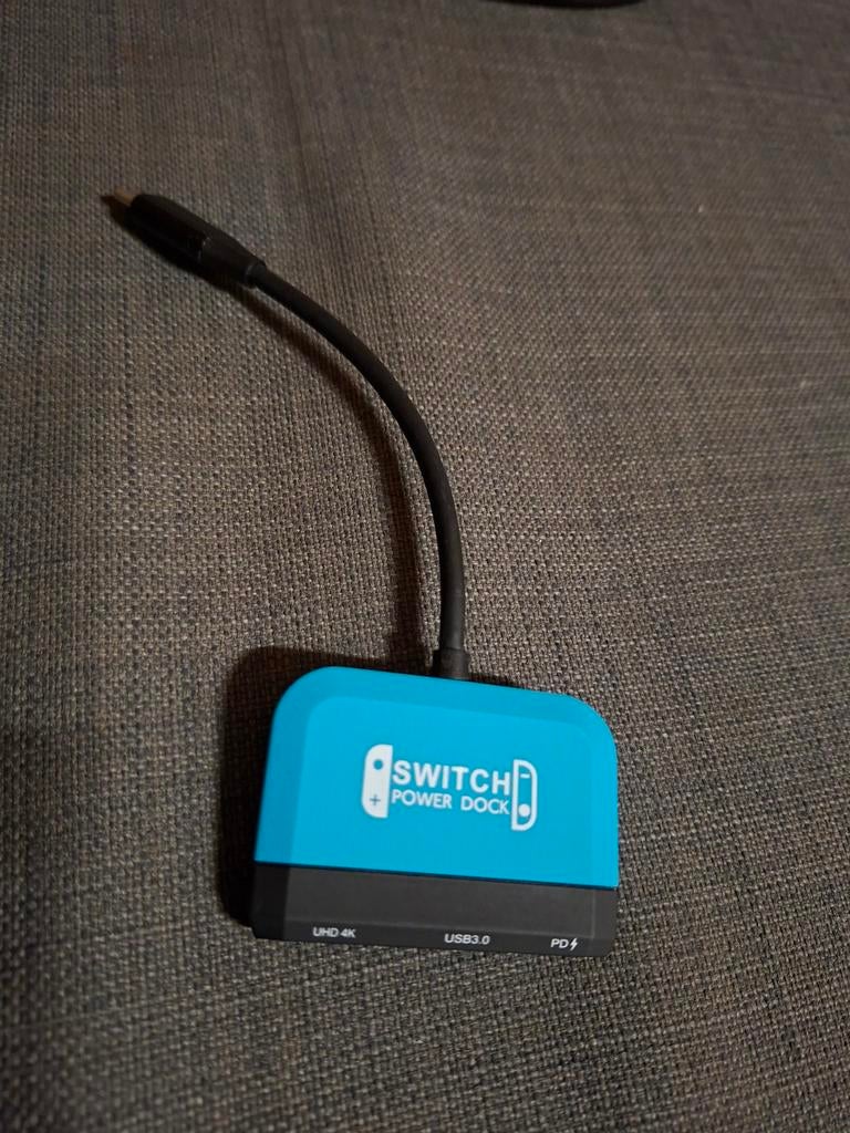 Nintendo Switch (1) power dock, Ophalen of Verzenden, Zo goed als nieuw, Switch