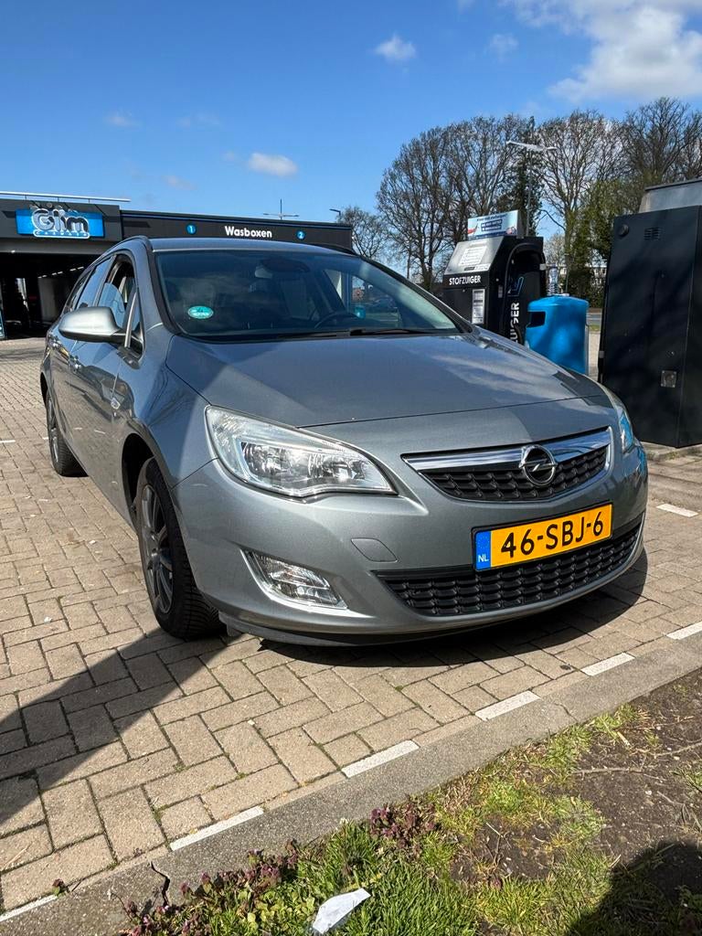 Opel Astra 1.4 Turbo 88KW ST 2011 Grijs, Auto's, Voorwielaandrijving, 4 cilinders, 1337 kg, Origineel Nederlands