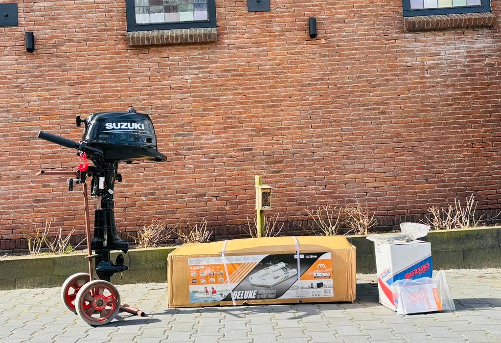 Gloednieuwe set Suzuki 5 pk en rubberboot (ongebruikt!), Watersport en Boten, Nieuw, Benzine, 200 pk of meer, Overige materialen