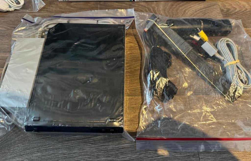 Nintendo Wii compleet met 10 spellen, Ophalen of Verzenden, Zo goed als nieuw, Met 2 controllers, Met stuurtje