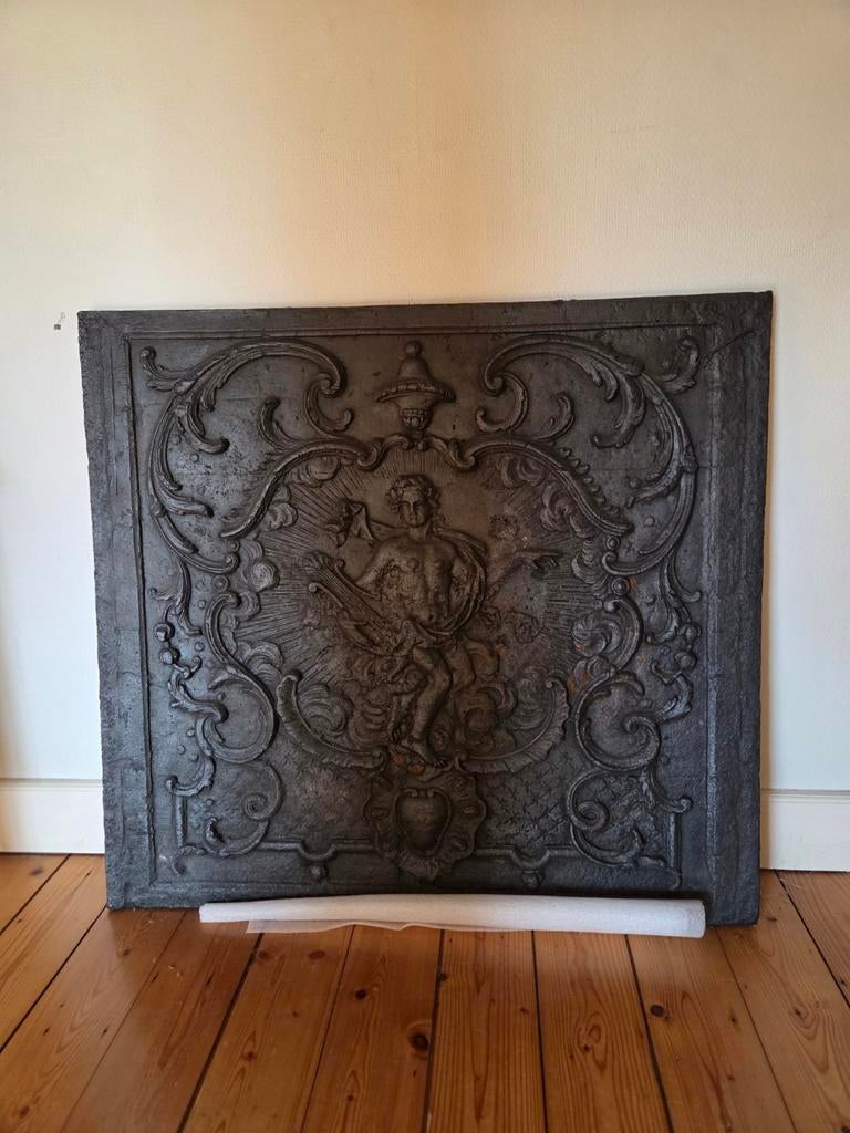 Antieke haardplaat en vuurrek, Ophalen