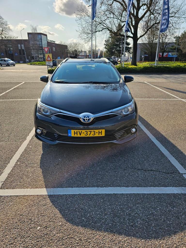 Toyota Auris 1.8 Hybrid Touring Sports CVT 2015 Grijs, Auto's, 28 km/l, 345 kg, Origineel Nederlands, Te koop