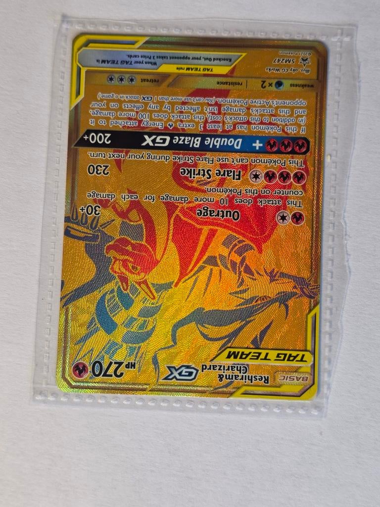 Reshiram & Charizard GX Pokémon Kaart SM147 Gold, Ophalen of Verzenden, Zo goed als nieuw, Losse kaart, Foil