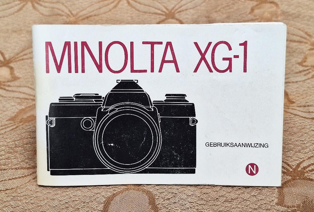Nederlandse gebruiksaanwijzing handleiding Minolta XG-1, Audio, Tv en Foto, Fotocamera's Analoog, Ophalen of Verzenden, Gebruikt