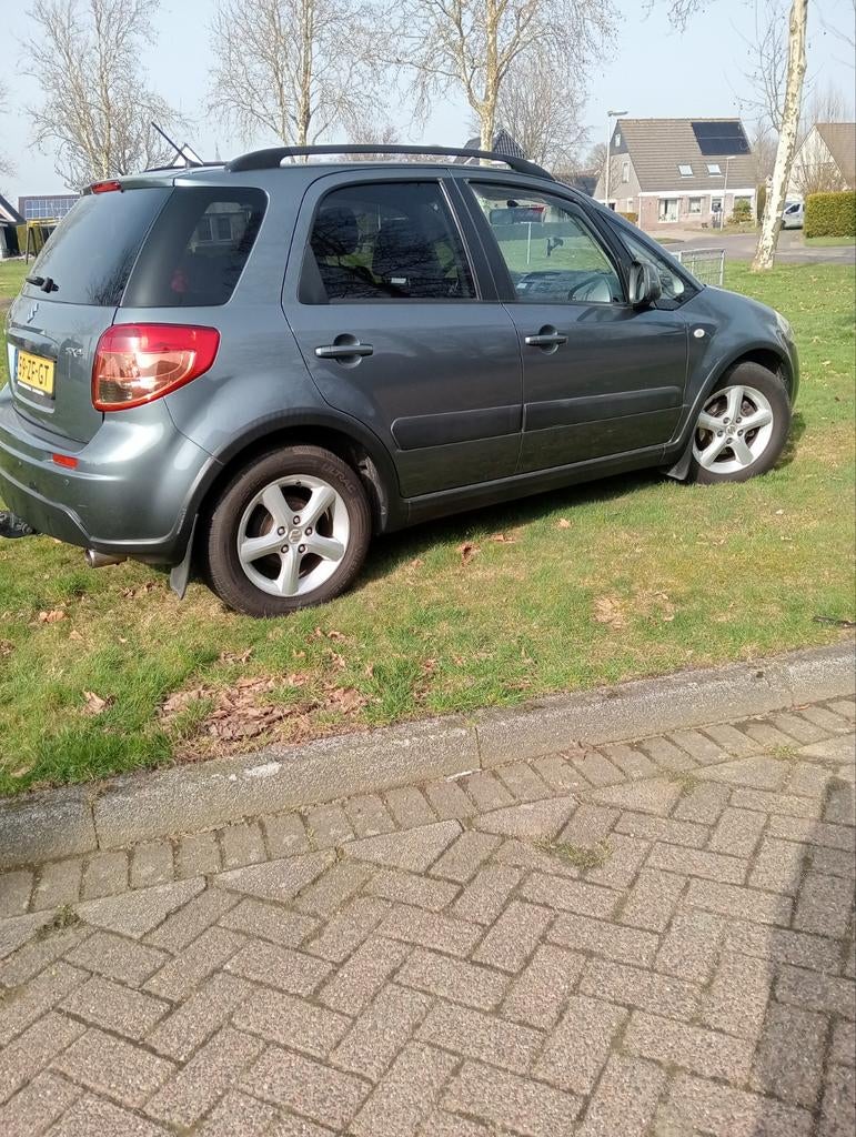 Suzuki SX4 1.6 2008 Grijs, Auto's, Zwart, 4 cilinders, 49 €/maand, Origineel Nederlands