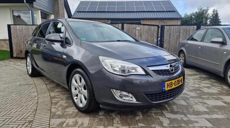 Opel Astra J 1.4T  2011 - Unieke luxe uitvoering!, Auto's, Voorwielaandrijving, Euro 5, Stof, Zwart