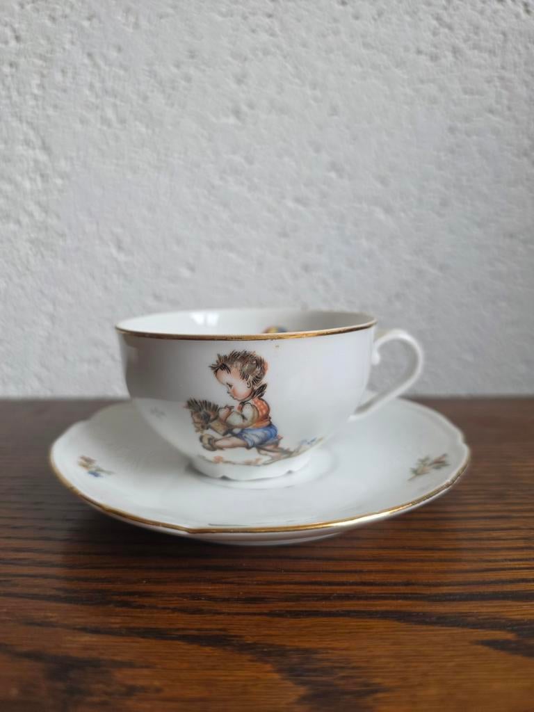 Vintage kop en schotel met kinder- en vogelmotief, Antiek en Kunst, Ophalen of Verzenden