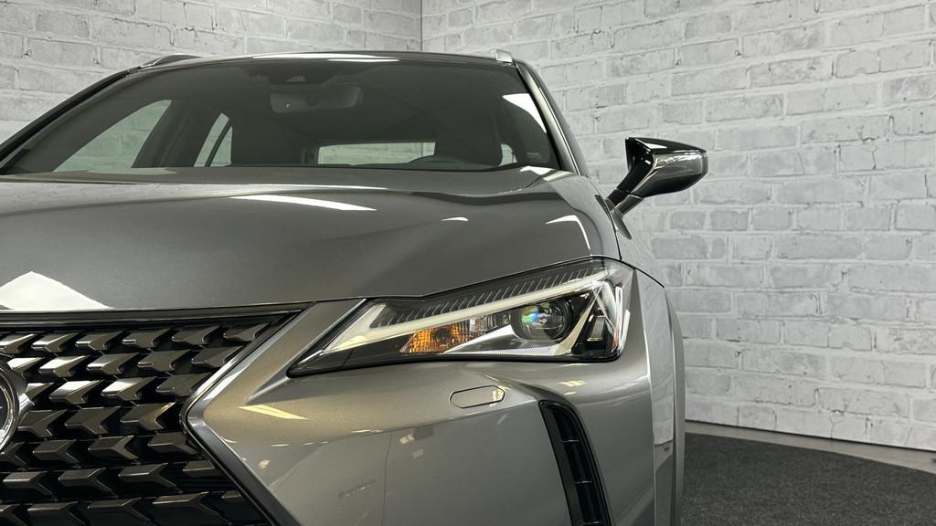 Lexus UX 250h First Edition / Stoel/stuurverwr / Carplay / A, Auto's, Lexus, Stof, Gebruikt, 4 cilinders, Grijs