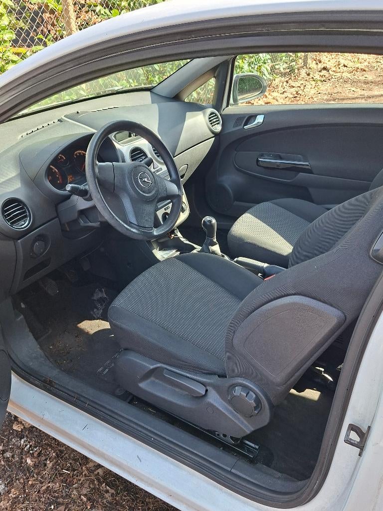Opel Corsa 1.0 12V 3D 2009 Wit, Auto's, Voorwielaandrijving, 40 €/maand, Wit, Handgeschakeld