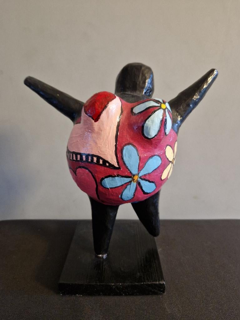 Beeld van papier maché, Ophalen