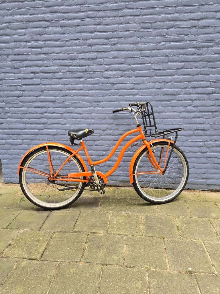 Oranje Hollanda meisjesfiets met terugtraprem, Ophalen