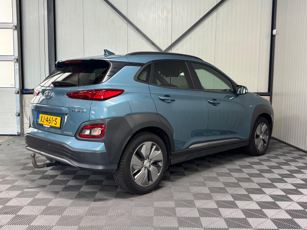 Hyundai Kona EV Premium 64kWh | SOH 100% | Leer | Navi | Tre, Gebruikt, Blauw, Regensensor, 630 min