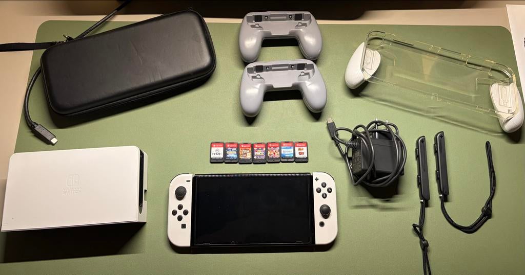 Nintendo Switch OLED met 6 games en accessoires, Spelcomputers en Games, Gebruikt, Overige genres, Eén computer, Ophalen of Verzenden