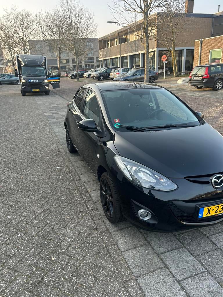 Mazda 2 1.3 62KW 5-DRS 2013 Zwart, Auto's, Voorwielaandrijving, Stof, 4 cilinders, Zwart