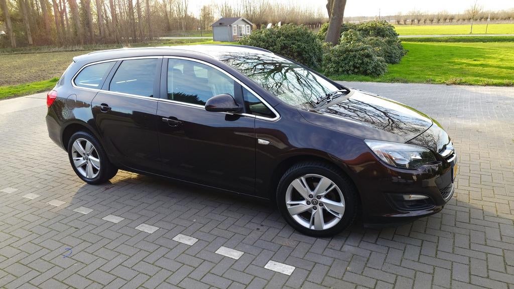 Opel Astra 1.4 Turbo 88KW Sports Tourer 2014 Bruin, Auto's, Voorwielaandrijving, Stof, 4 cilinders, Bruin