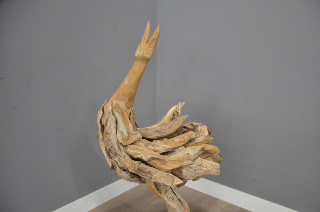 Handgemaakte teak vogel, Ophalen