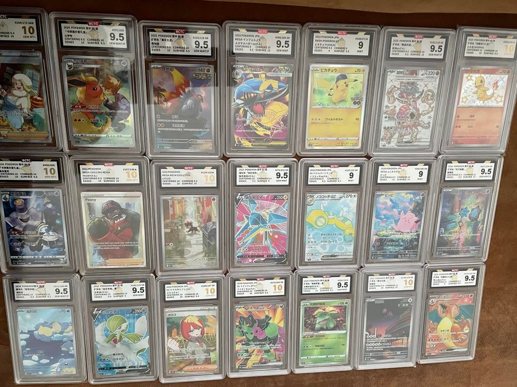 Pokemon slabs 21 stuks - incl. gegrade Charizard en Pikachu, Ophalen of Verzenden, Nieuw, Losse kaart, Foil